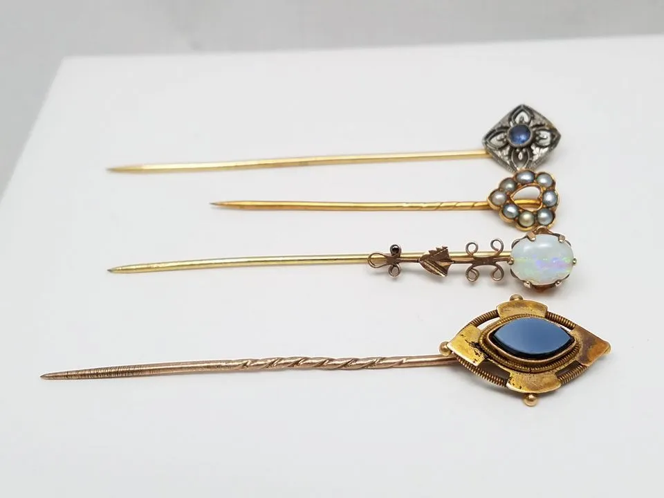 Four 8k - 18k Yellow Gold Pins